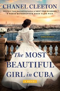 cover of The Most Beautiful Girl in Cuba, showing a dark haired woman wearing a white victorian dress. with her back to the viewer she looks out over a harbor